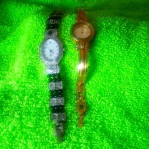 2 nice vintage Avon watches